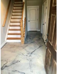 Marbled metallic epoxy flooring finish in a residential hallway