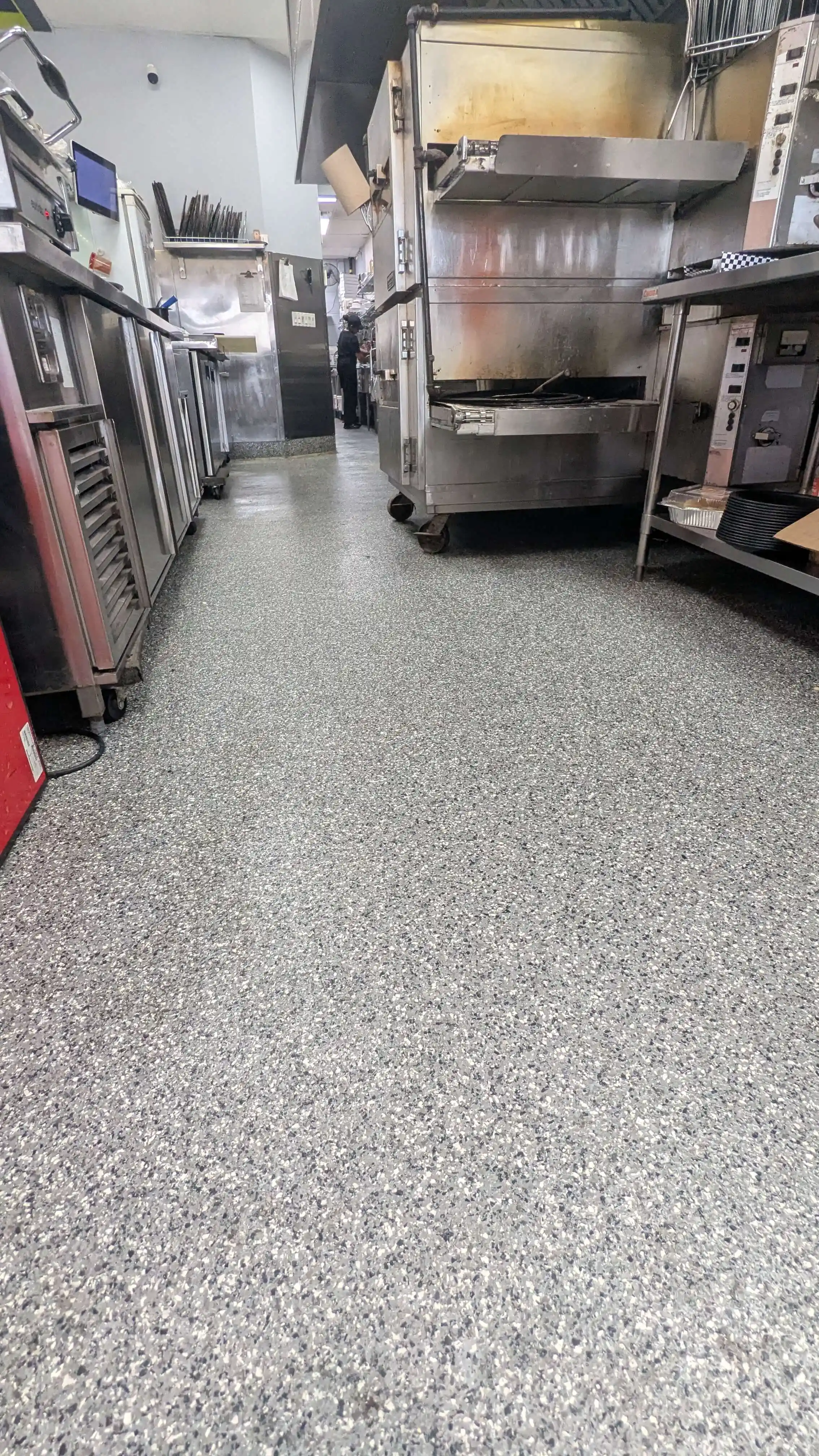 NSF food-safe epoxy flooring for restaurant kitchen in Toronto - grease-resistant seamless surface