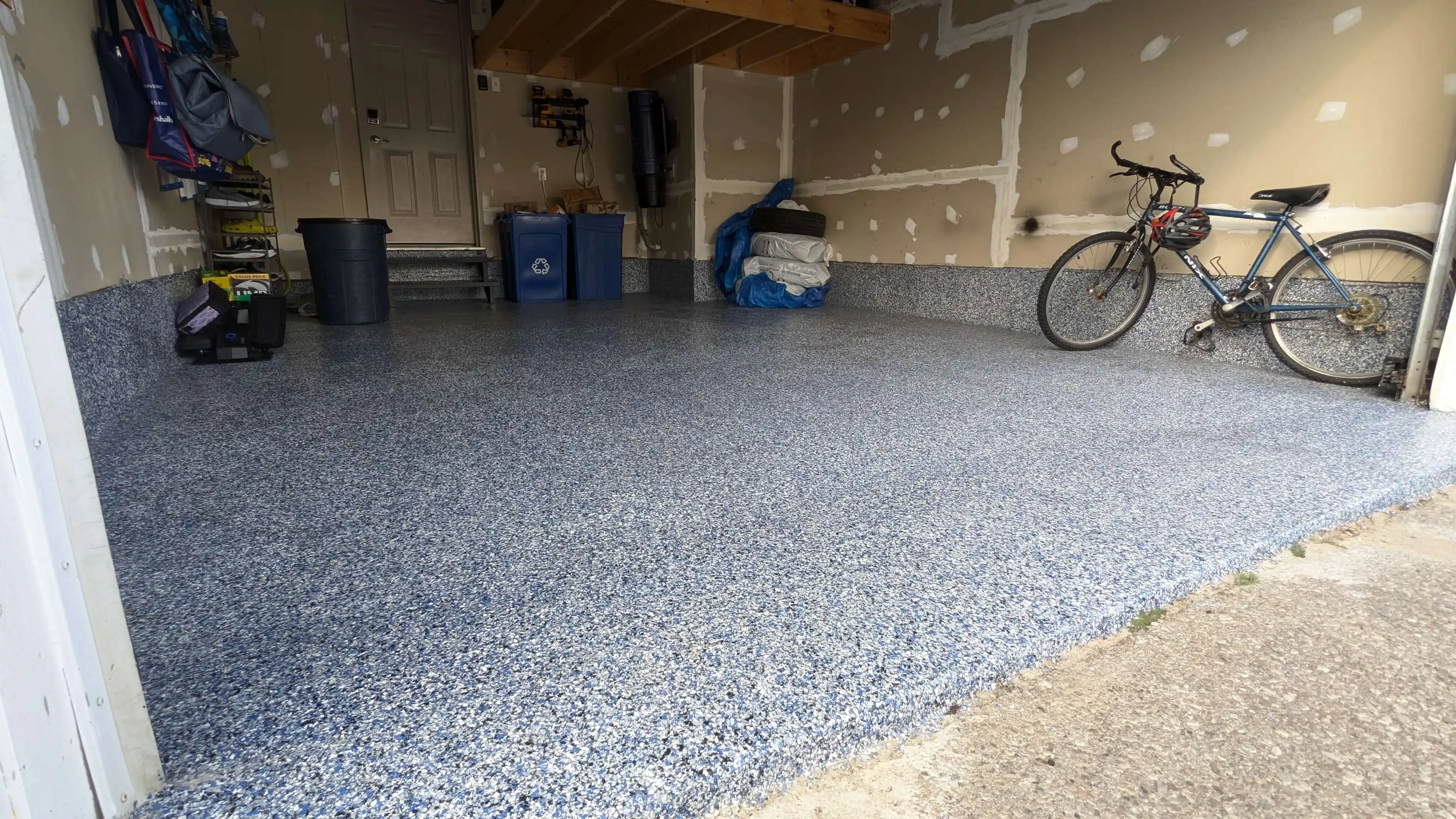 Epoxy garage flooring with metallic finish and flake blend in Mississauga