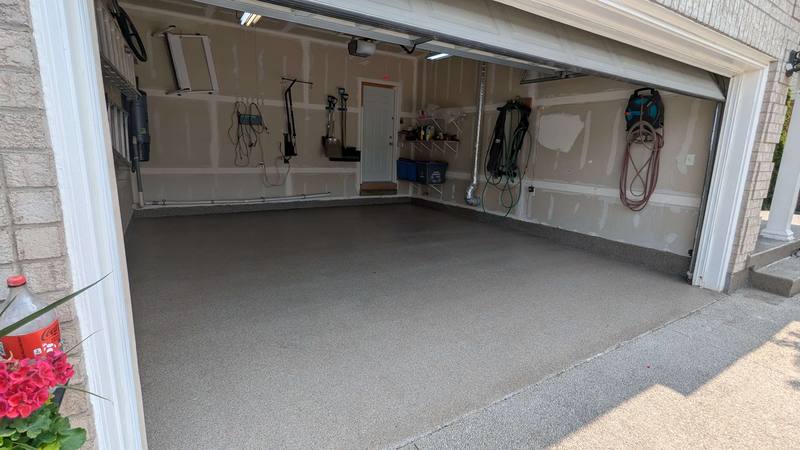 Industrial flake flooring system in commercial warehouse space