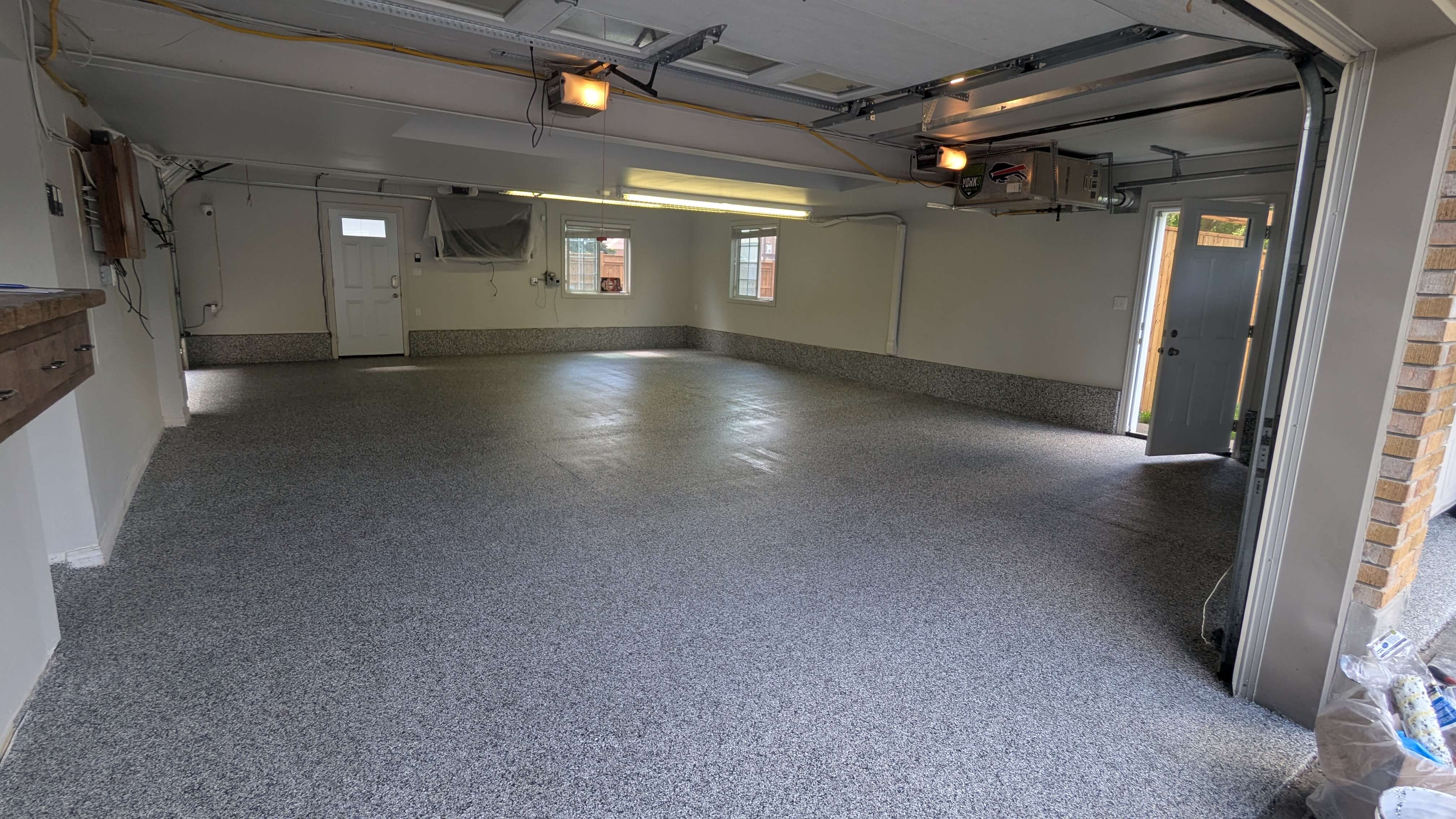 Garage epoxy flooring with decorative chips and gloss finish in Oshawa