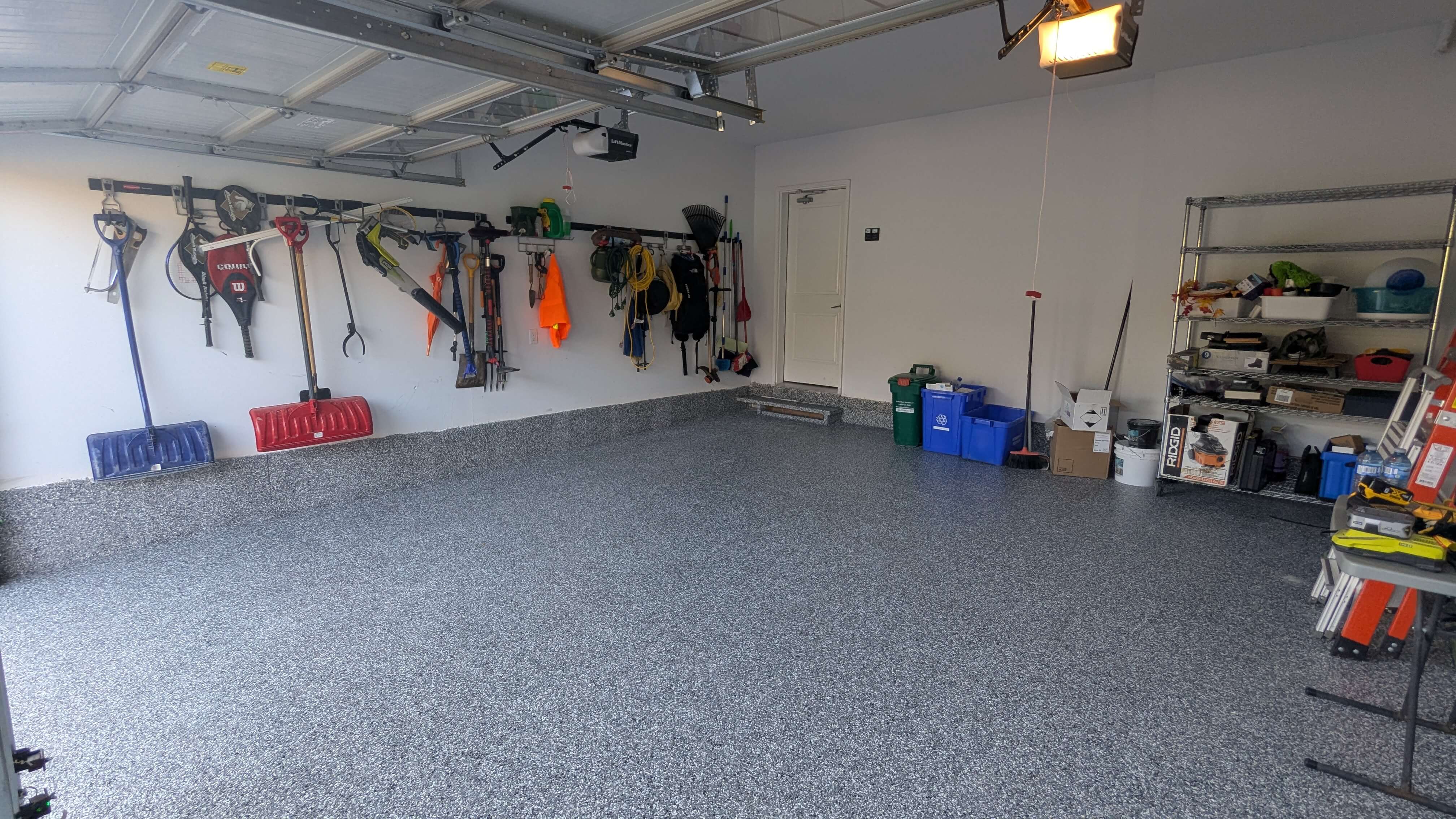 Garage storage management and epoxy flake floor in Oakville