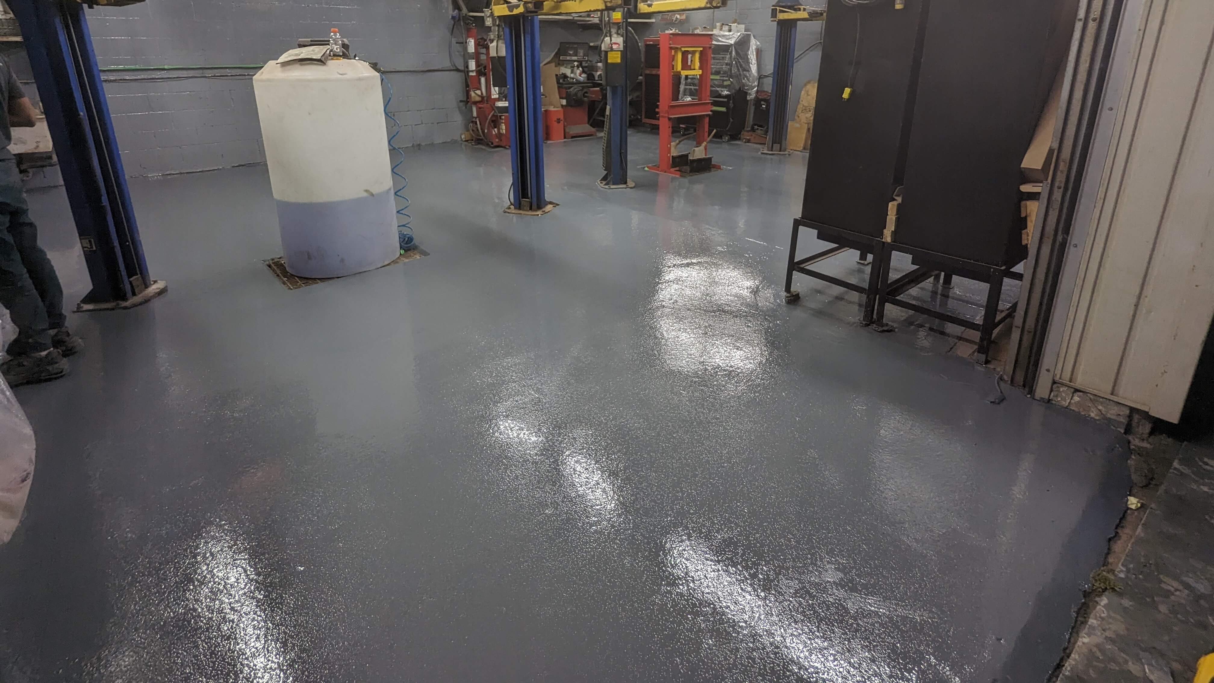 Oil-resistant epoxy flooring for mechanic shop in Toronto - fuel-resistant durable coating
